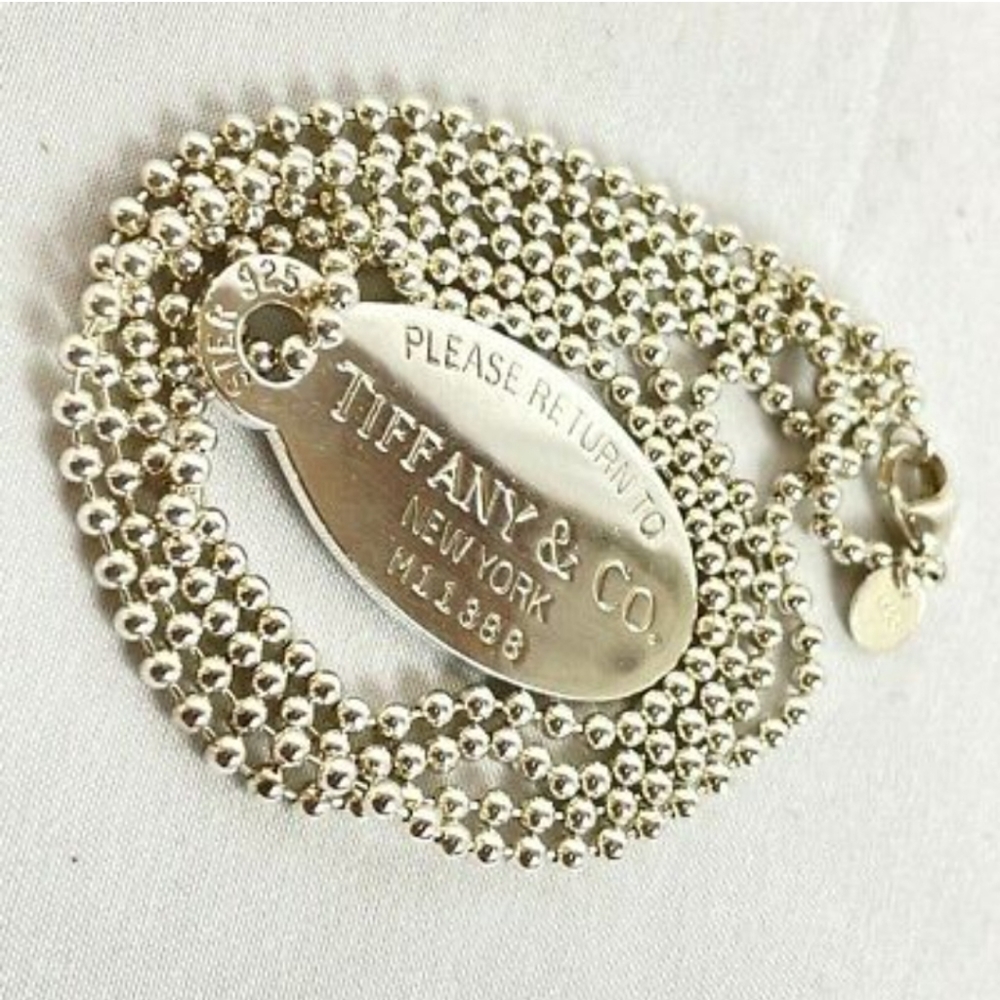 - TIFFANY AND CO..Return to Tiffany's 34 inch Dog Tag